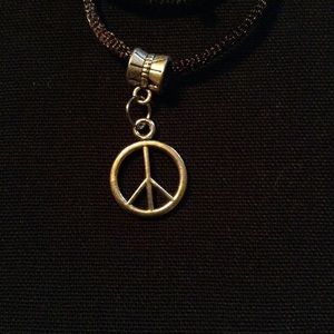 Silver tone Peace necklace. 2/$10